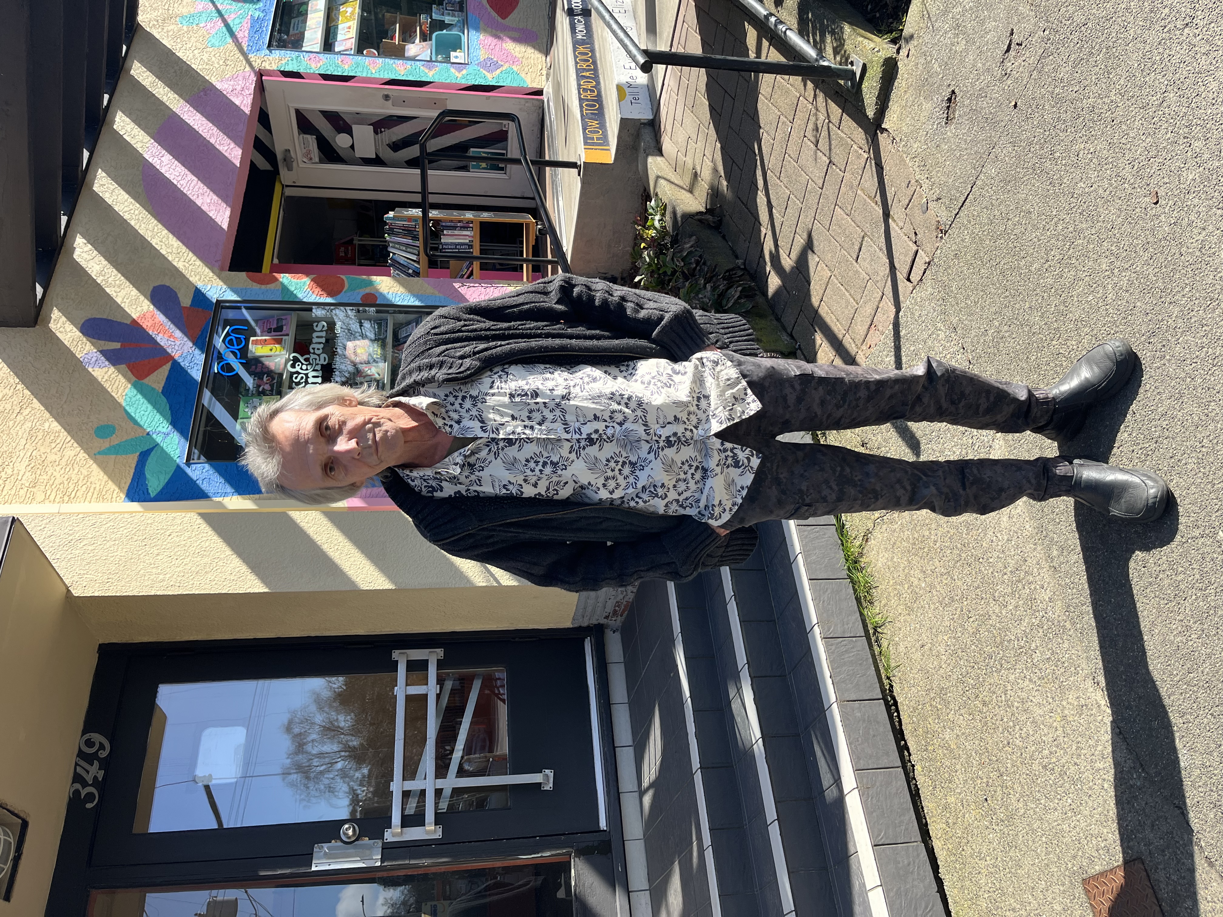 Mark Plank standing in front of 349 Cook Street.